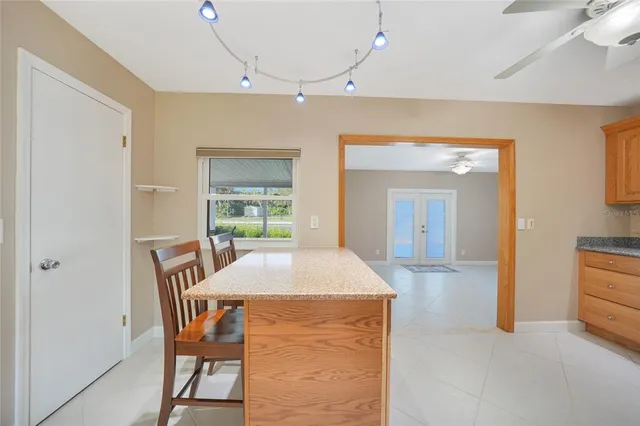 a dining room with a table and chairs