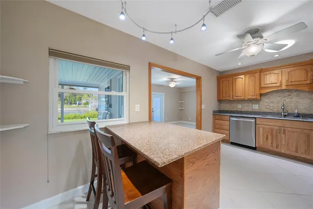 a kitchen with a table and chairs in it