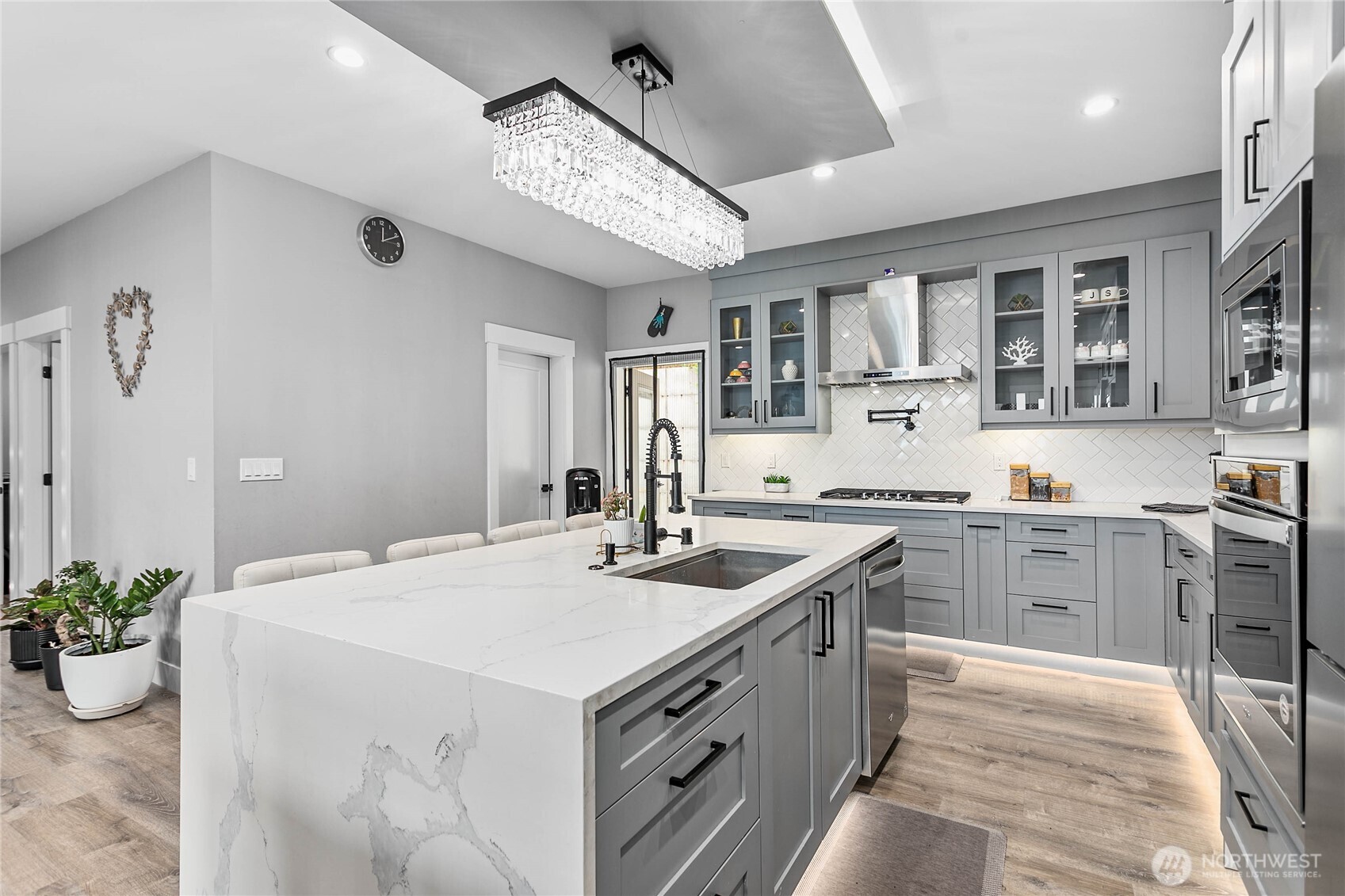 2144 Riverstone Loop Ferndale, WA 98248 - Photo 14 of 36 a kitchen with a sink stove and cabinets