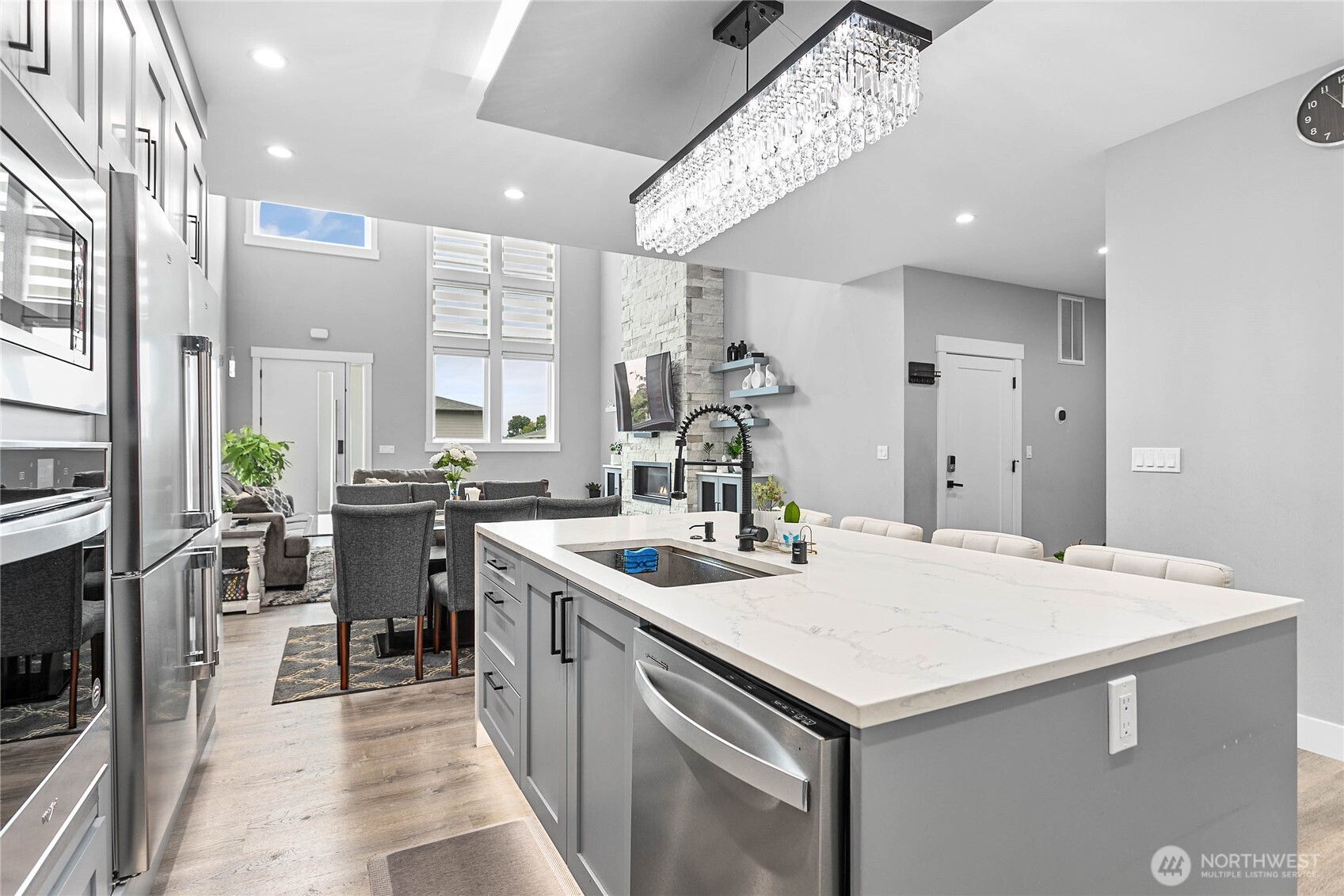 2144 Riverstone Loop Ferndale, WA 98248 - Photo 15 of 36 a kitchen with a sink a stove and chairs