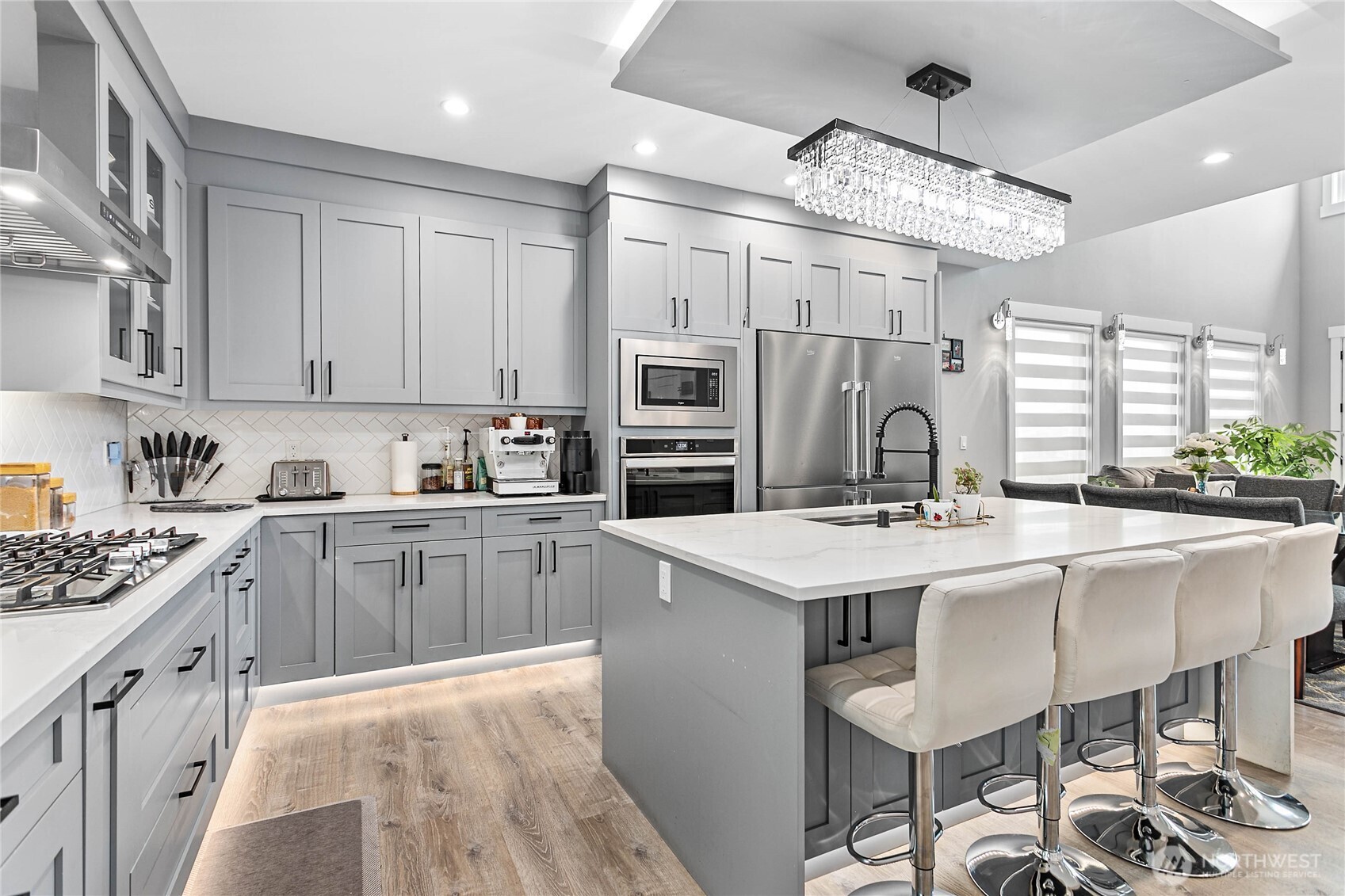 2144 Riverstone Loop Ferndale, WA 98248 - Photo 16 of 36 a kitchen with stainless steel appliances granite countertop a stove refrigerator and cabinets