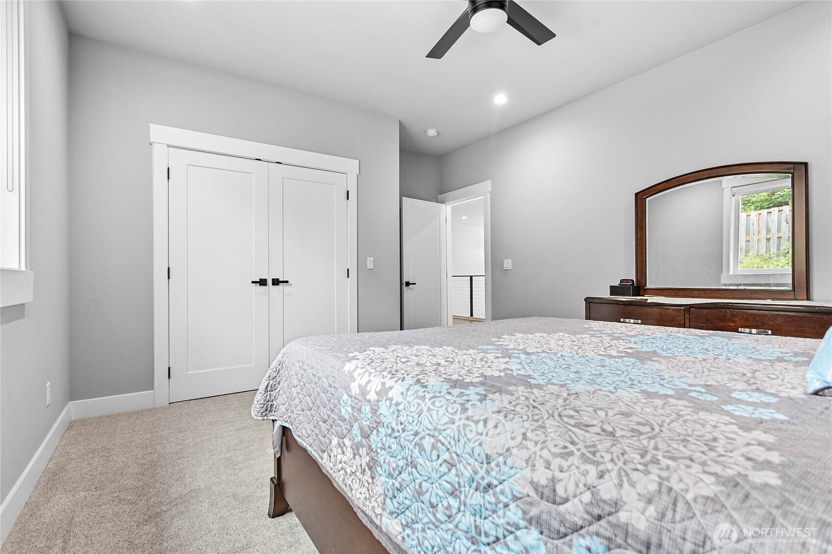 2144 Riverstone Loop Ferndale, WA 98248 - Photo 27 of 36 a bedroom with a bed and a mirror