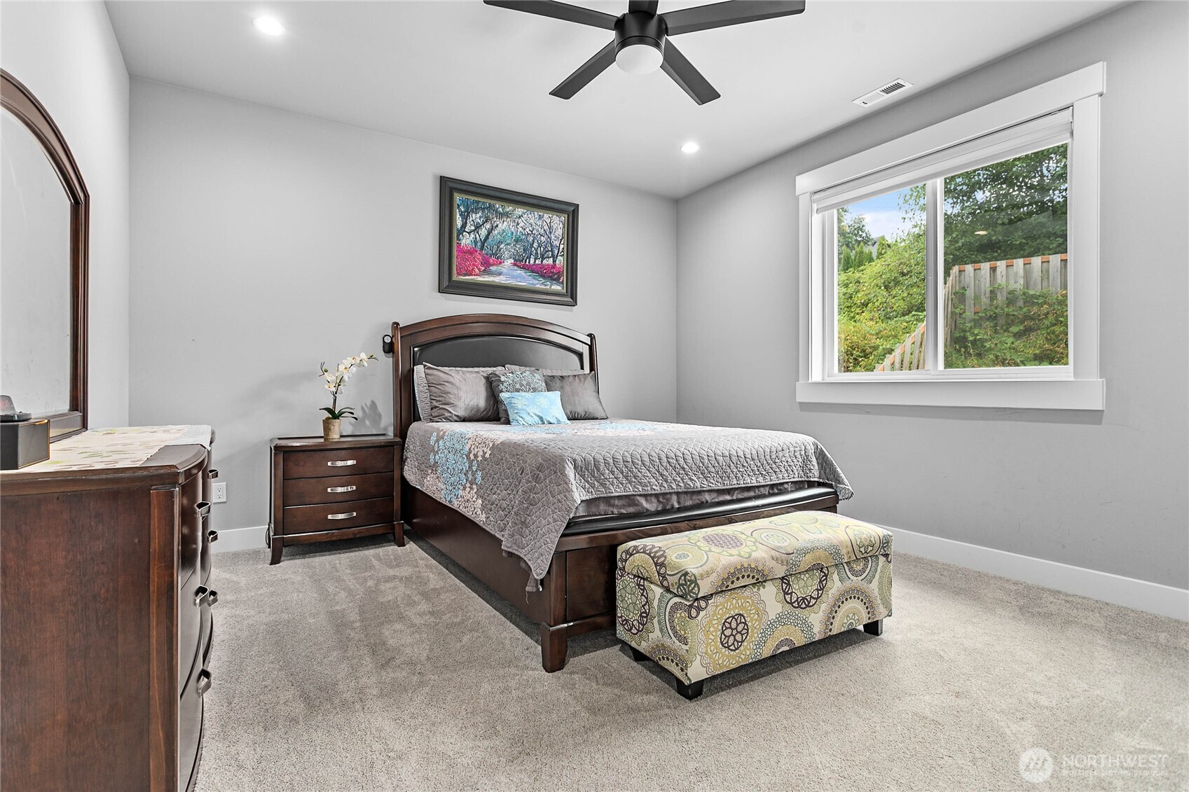 2144 Riverstone Loop Ferndale, WA 98248 - Photo 28 of 36 a bedroom with a bed and a chandelier