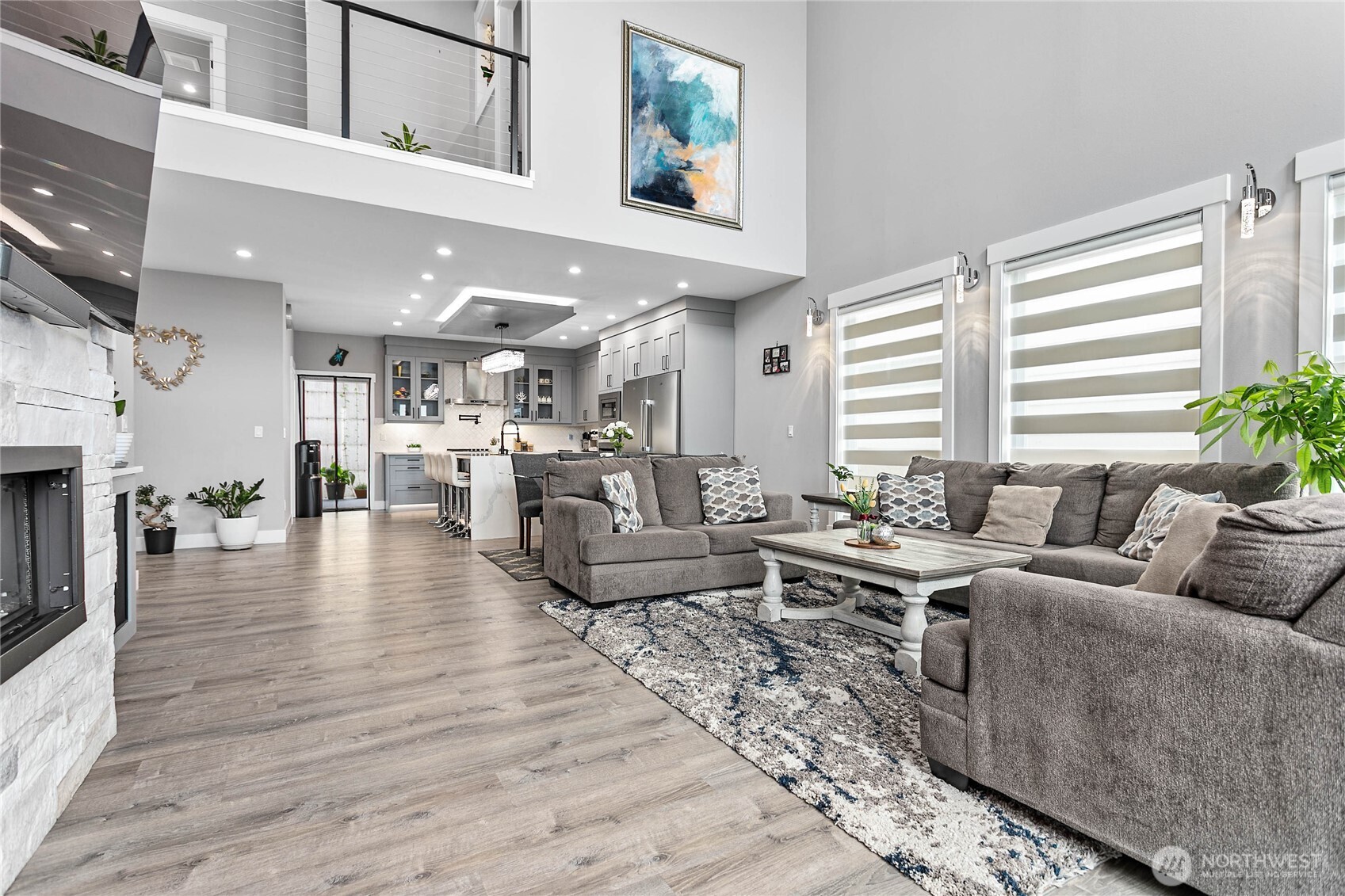 2144 Riverstone Loop Ferndale, WA 98248 - Photo 5 of 36 a living room with furniture wooden floor and a fireplace