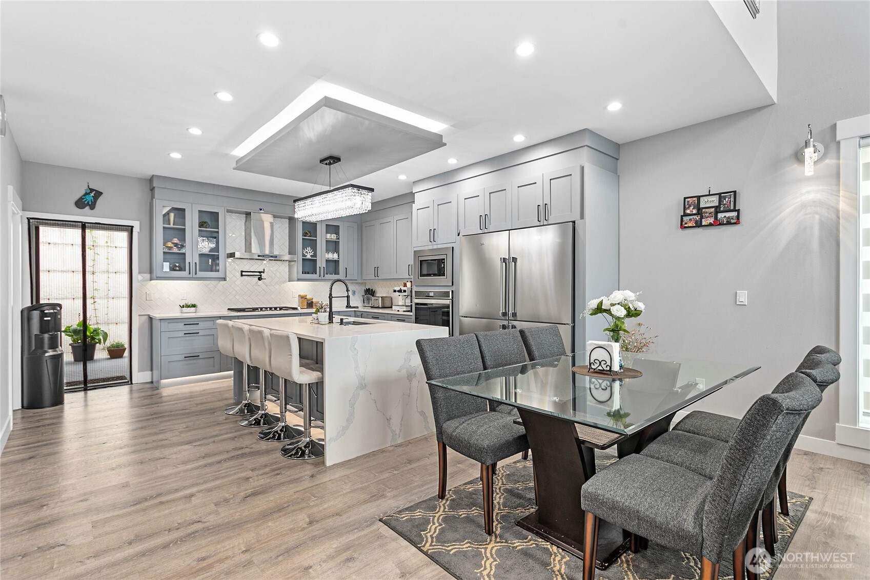 2144 Riverstone Loop Ferndale, WA 98248 - Photo 9 of 36 a view of a dining room with furniture and wooden floor