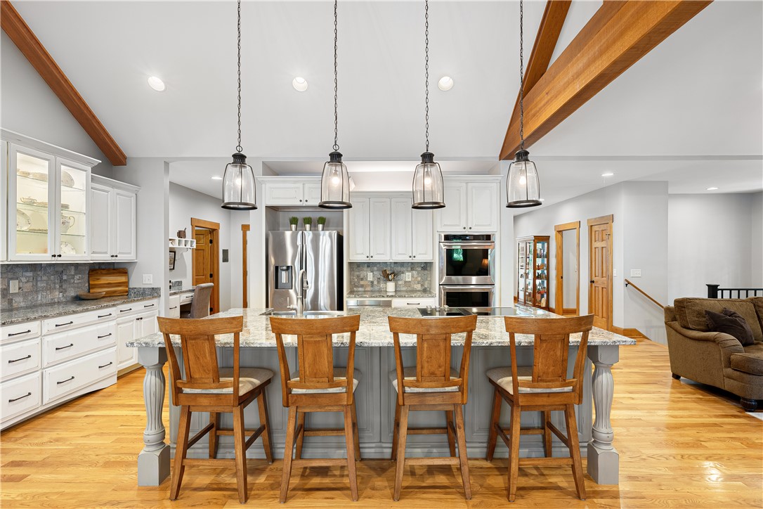 285 Bertha Allen Road Westminster, SC 29693 - Photo 4 of 50 A gourmet kitchen boasts high ceilings, stone counters, and gleaming hardwood floors.