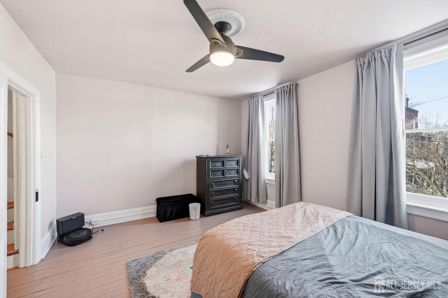 346 East Union Street Burlington, NJ 08016 - Photo 25 of 48 a bedroom with a bed and a chandelier