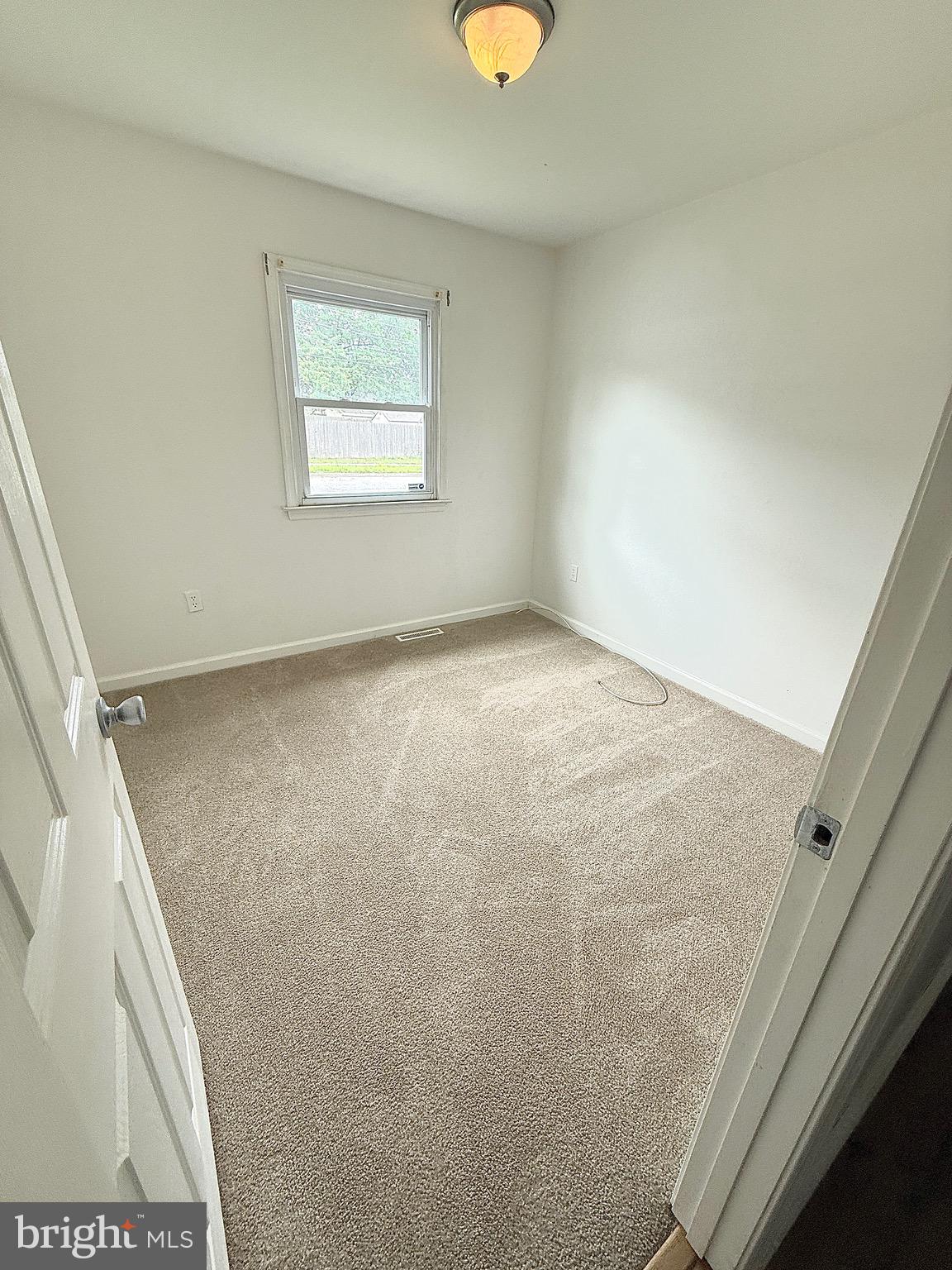 195 Mitscher Road Dover, DE 19901 - Photo 15 of 24 a view of a window in an empty room