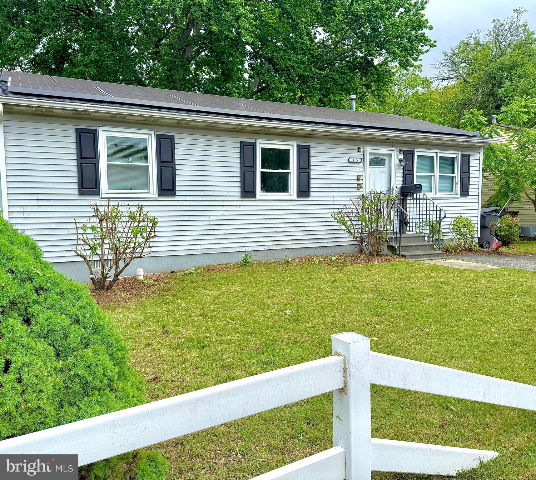 195 Mitscher Road Dover, DE 19901 - Photo 20 of 24 a front view of a house with a yard table and chairs
