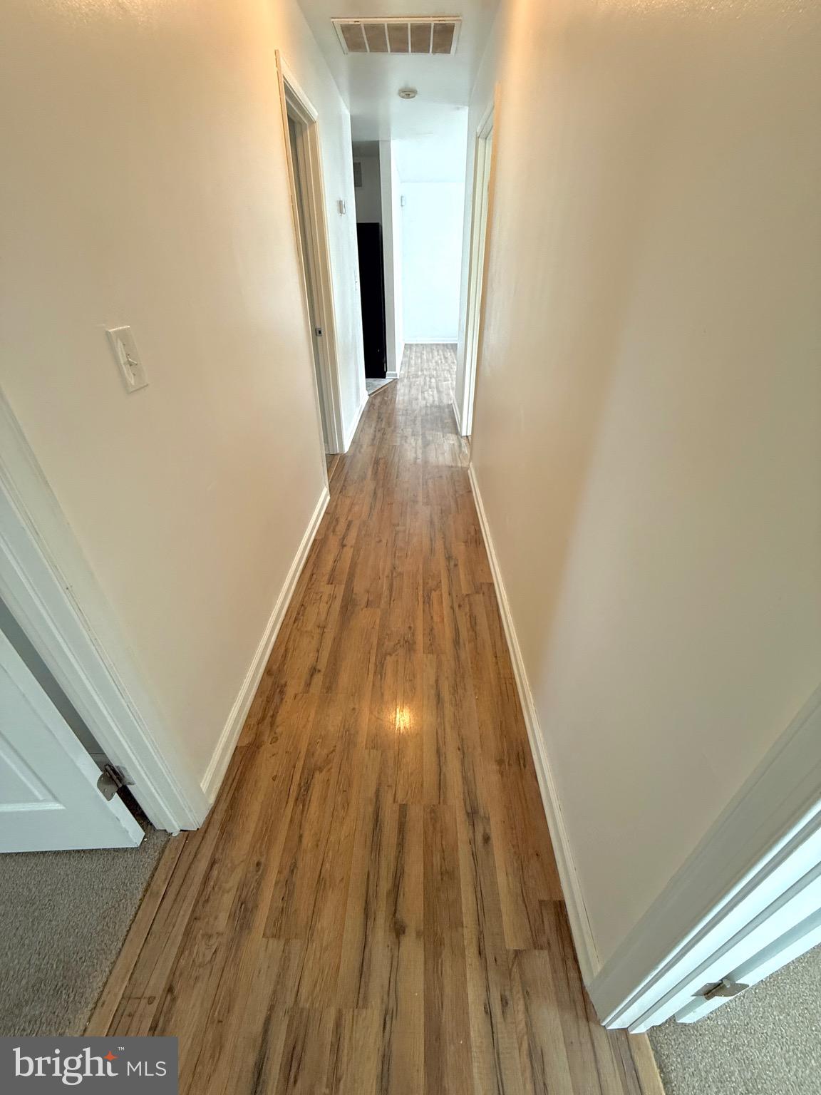 195 Mitscher Road Dover, DE 19901 - Photo 10 of 24 a view of wooden floor in a hallway