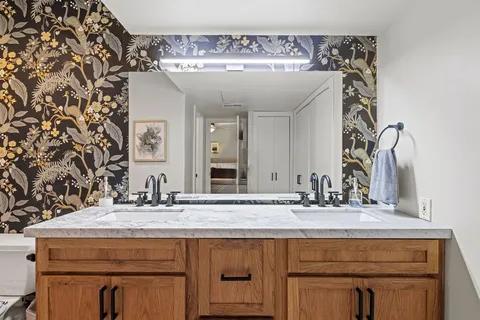 a bathroom with a sink and a mirror