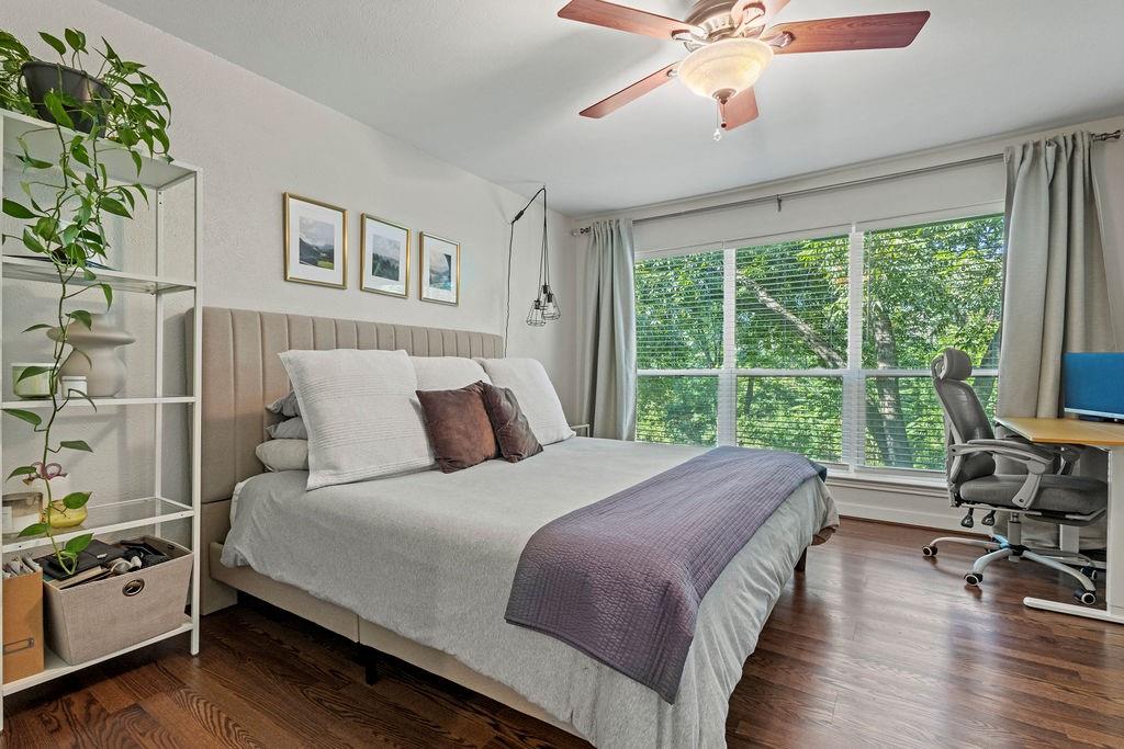 9222 Church Road, Unit 117 Dallas, TX 75231 - Photo 24 of 24 a bedroom with a bed a large window with table and chairs