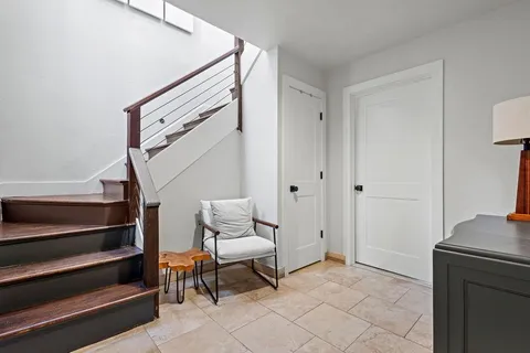 a view of room with furniture and wooden floor