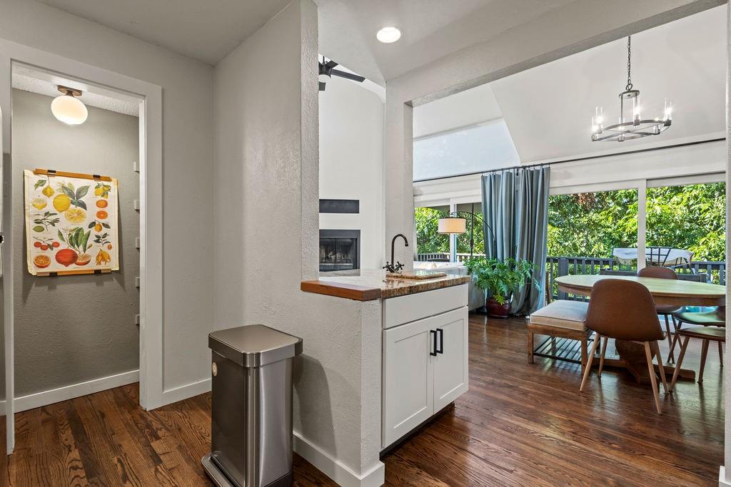 9222 Church Road, Unit 117 Dallas, TX 75231 - Photo 9 of 24 a kitchen with stainless steel appliances granite countertop a table chairs and a large window