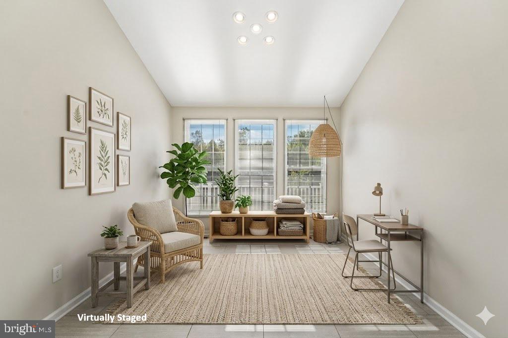 1461 Pangbourne Way Hanover, MD 21076 - Photo 21 of 51 a living room with furniture and floor to ceiling windows