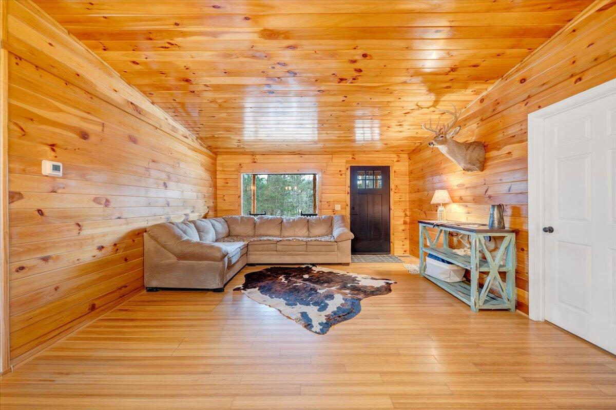 8013 Springwood Road Buchanan, VA 24066 - Photo 13 of 50 a living room with furniture wooden floor and a fireplace