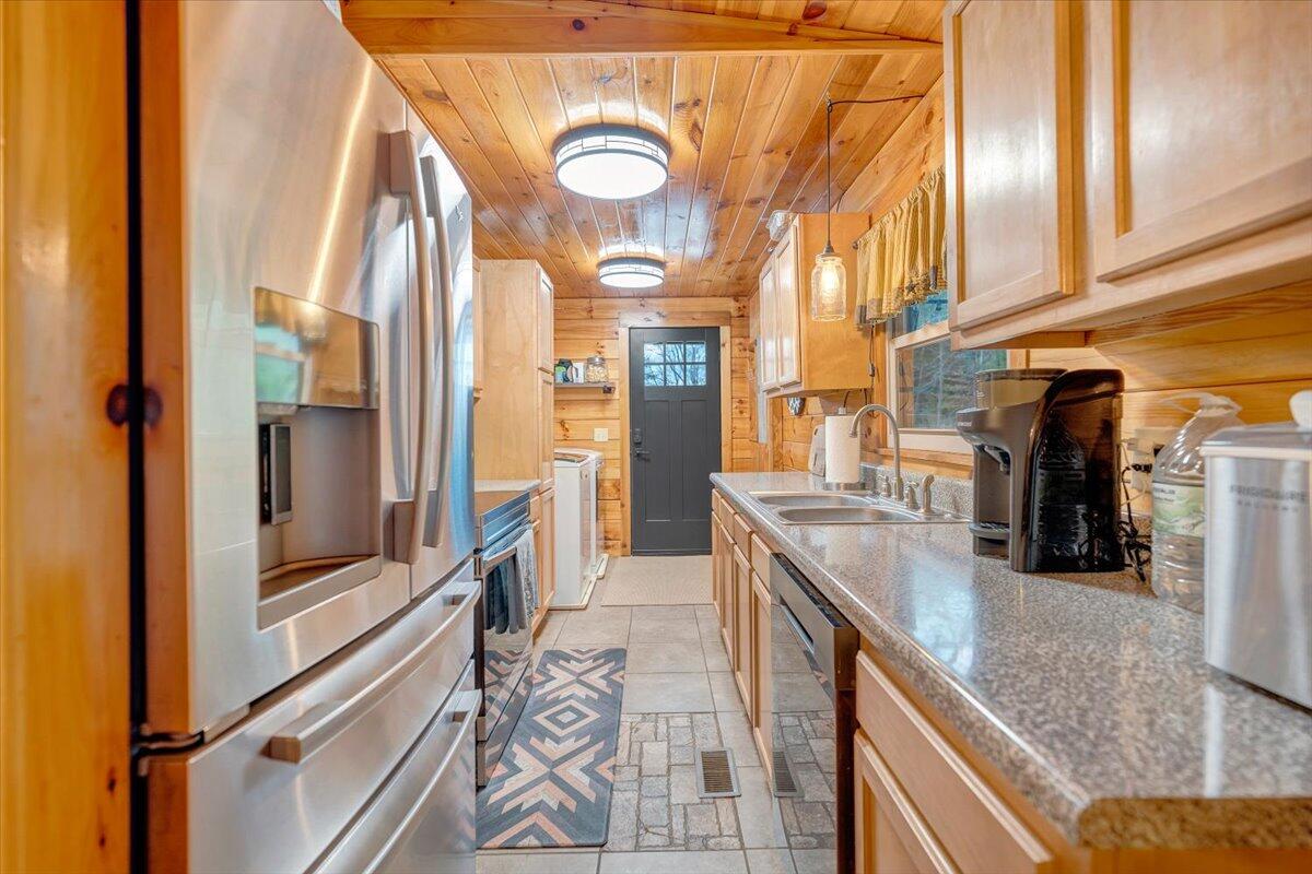 8013 Springwood Road Buchanan, VA 24066 - Photo 20 of 50 a kitchen with stainless steel appliances granite countertop lots of counter top space and wooden floor