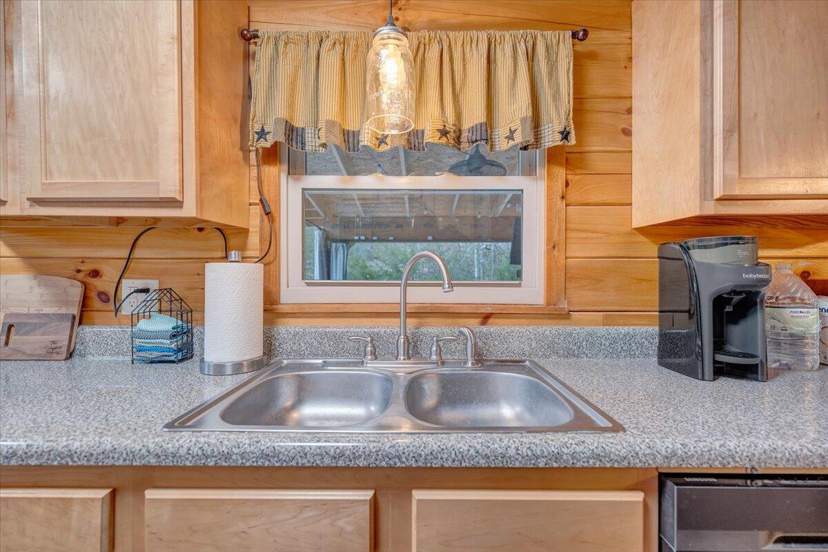 8013 Springwood Road Buchanan, VA 24066 - Photo 22 of 50 a kitchen with granite countertop a sink and a window