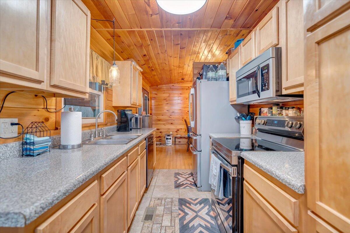 8013 Springwood Road Buchanan, VA 24066 - Photo 23 of 50 a kitchen with stainless steel appliances granite countertop a stove and a sink