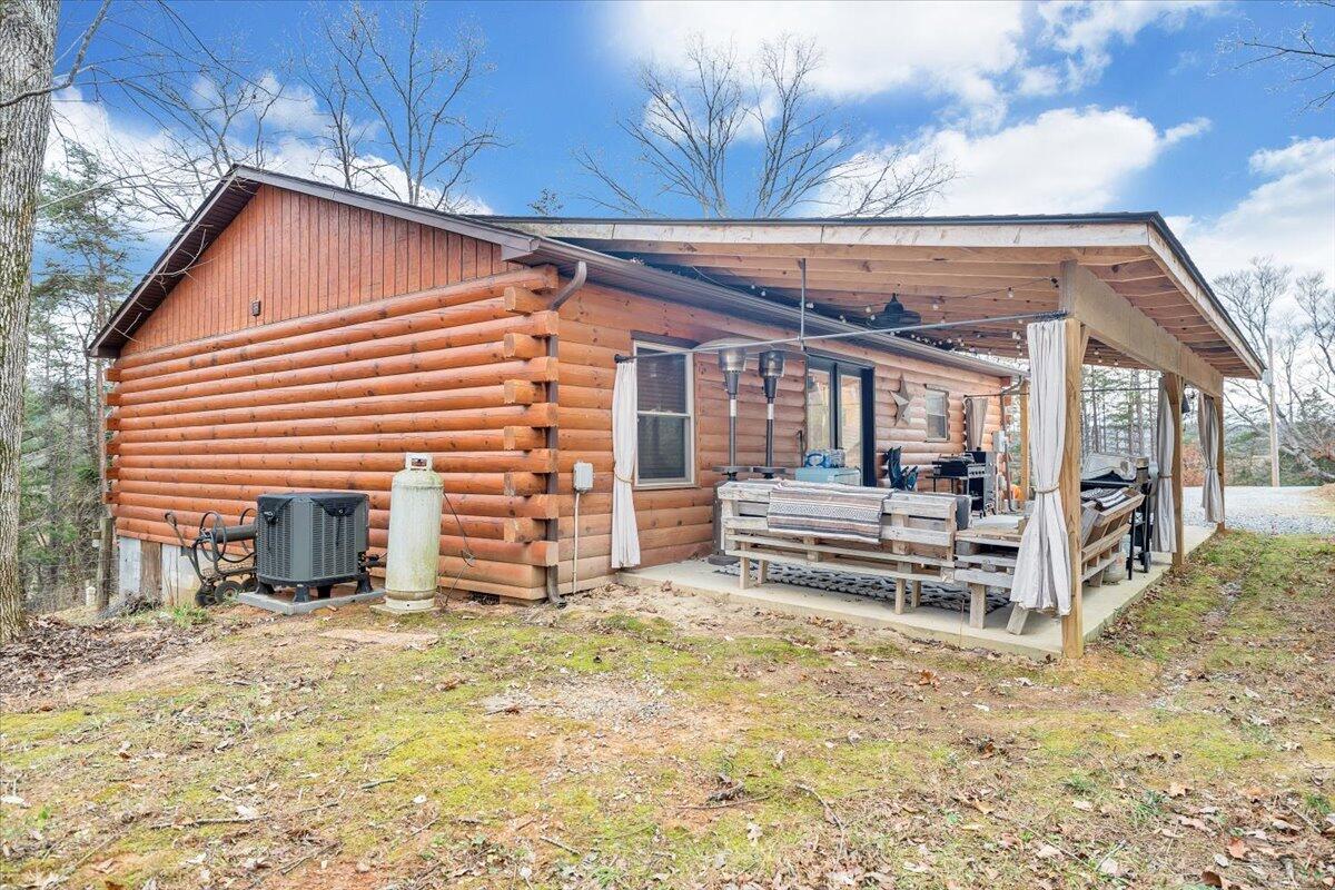 8013 Springwood Road Buchanan, VA 24066 - Photo 37 of 50 a view of a house with a backyard and wooden roof