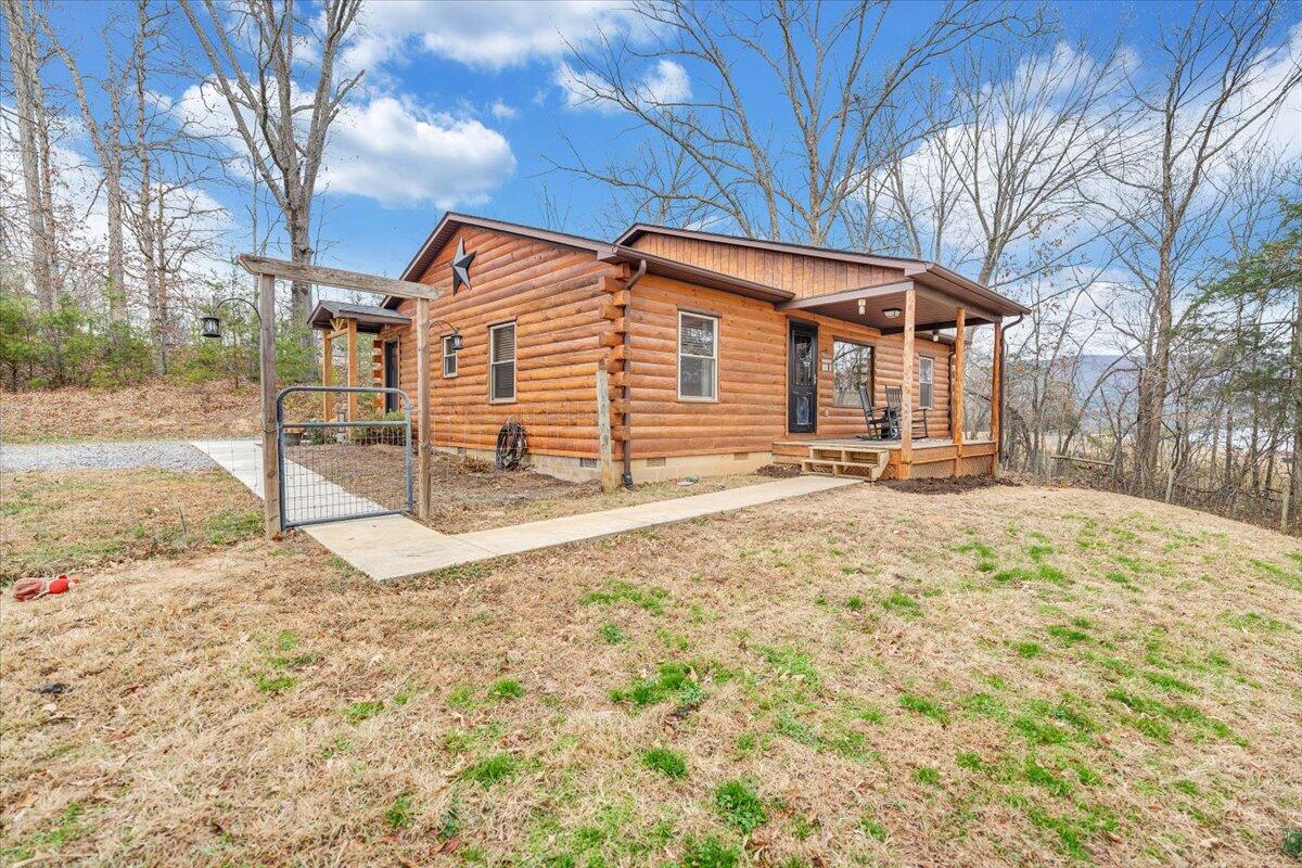 8013 Springwood Road Buchanan, VA 24066 - Photo 48 of 50 a backyard of a house with large trees