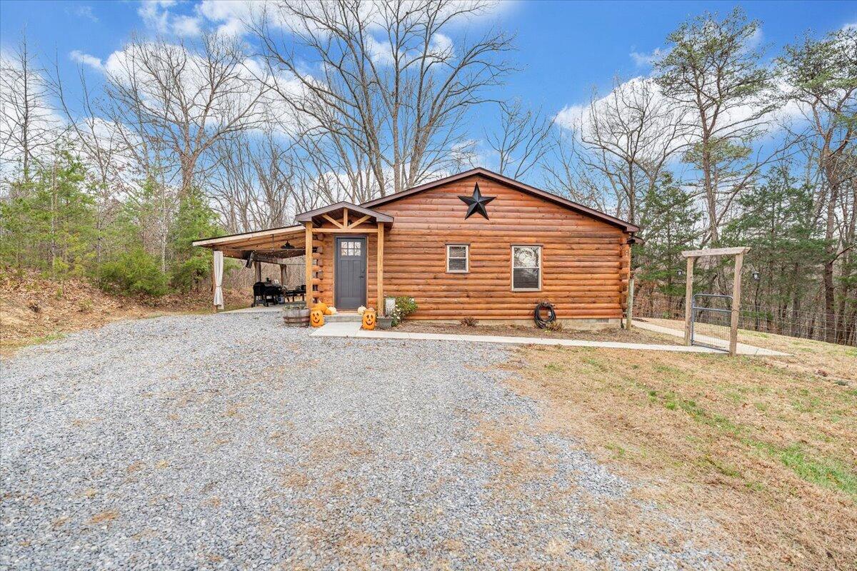 8013 Springwood Road Buchanan, VA 24066 - Photo 49 of 50 a front view of a house with a yard and garage