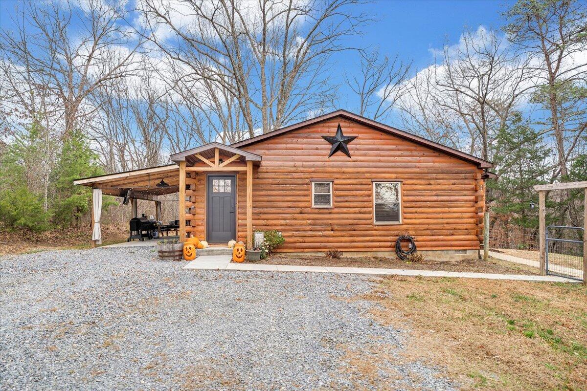 8013 Springwood Road Buchanan, VA 24066 - Photo 7 of 50 a view of a house with a yard and large tree