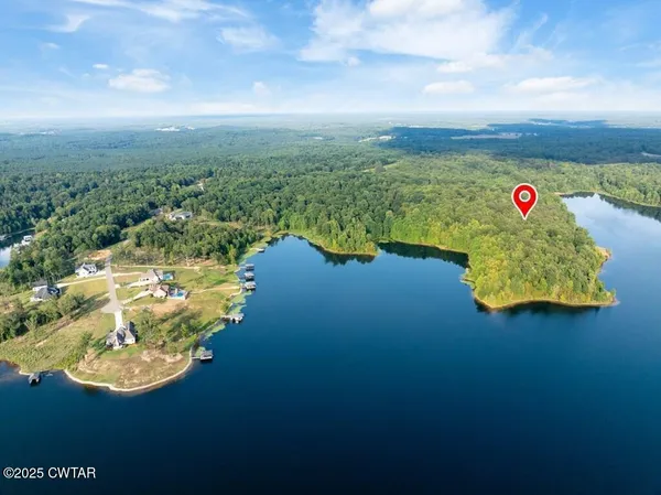 a view of a lake with a yard