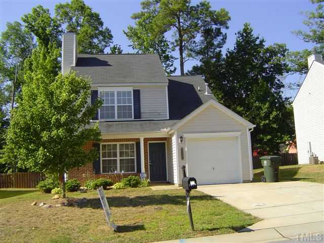 1204 Ricochet Drive Raleigh, NC 27610 - Photo 1 of 11 a front view of a house with garden and yard