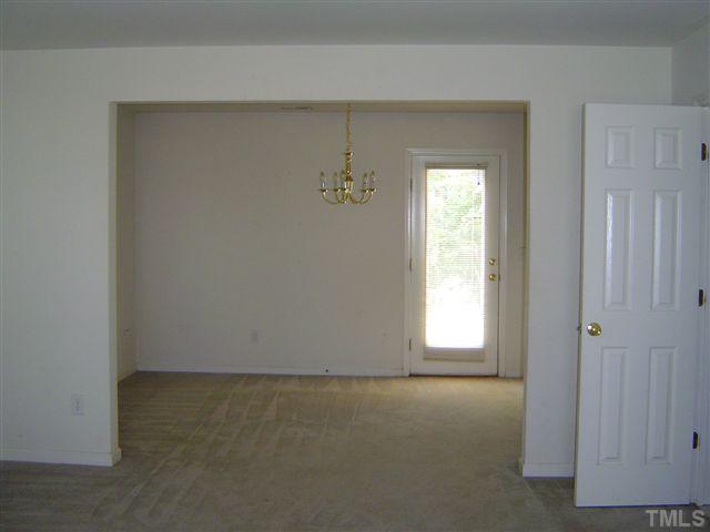1204 Ricochet Drive Raleigh, NC 27610 - Photo 5 of 11 an empty room with windows