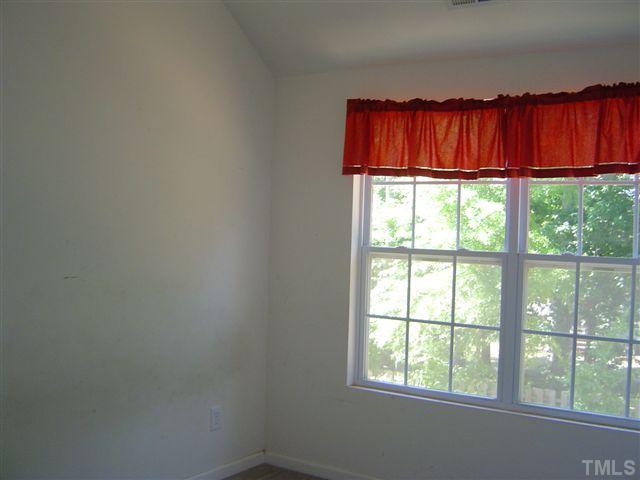 1204 Ricochet Drive Raleigh, NC 27610 - Photo 9 of 11 a view of a closet with wooden floor