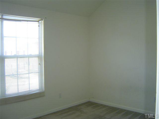 1204 Ricochet Drive Raleigh, NC 27610 - Photo 10 of 11 an empty room with a window