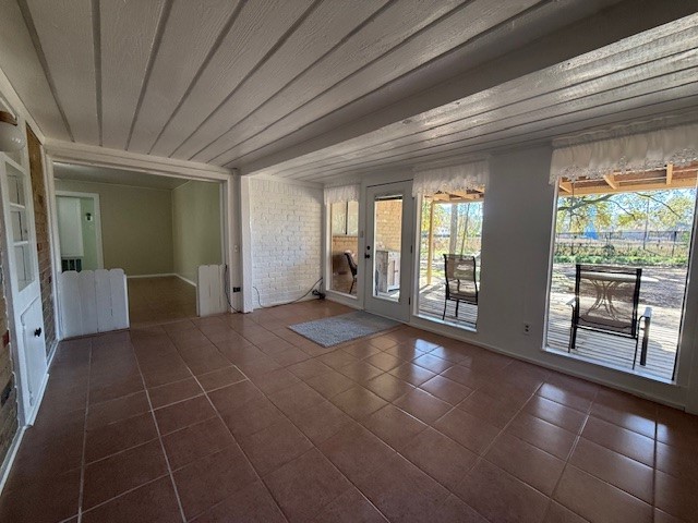 3411 Hickory Hollow Road Spring, TX 77380 - Photo 7 of 22 The large sunroom has a wall of windows that lead out to the back deck for indoor and outdoor living.