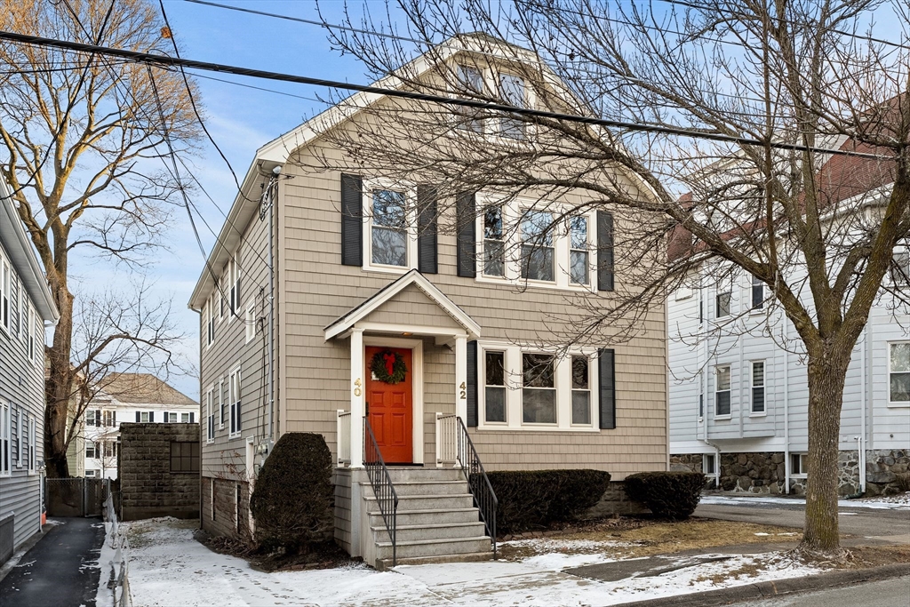 a front view of a house with large windows