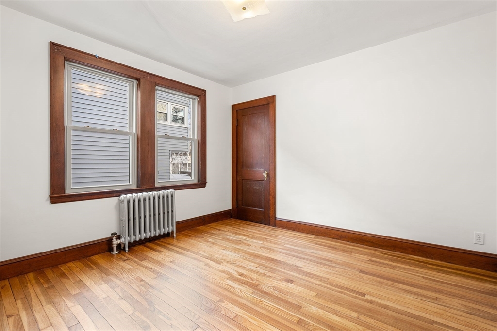 40-42 Upland Road Belmont, MA 02478 - Photo 11 of 35 an empty room with wooden floor and windows