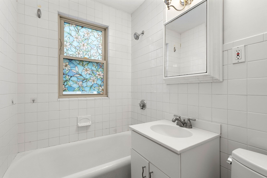 40-42 Upland Road Belmont, MA 02478 - Photo 12 of 35 a bathroom with a sink toilet and bathtub