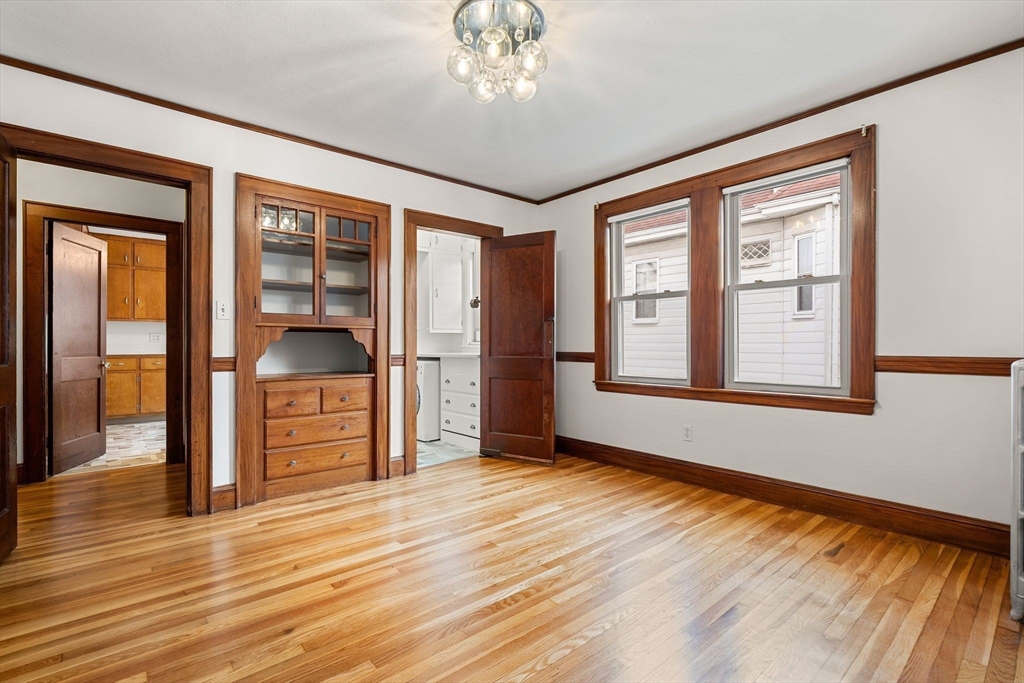 40-42 Upland Road Belmont, MA 02478 - Photo 18 of 35 a view of an empty room with a window and wooden floor