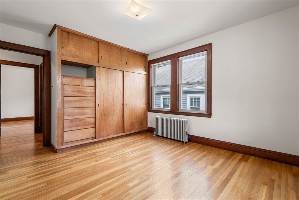 40-42 Upland Road Belmont, MA 02478 - Photo 20 of 35 an empty room with wooden floor and windows