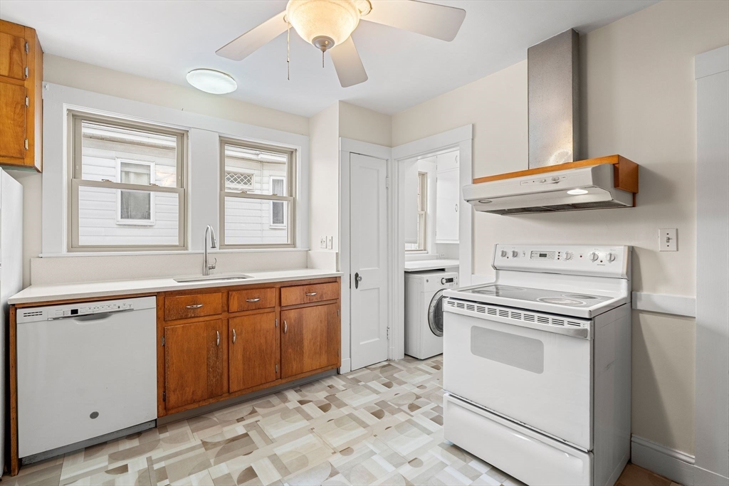 40-42 Upland Road Belmont, MA 02478 - Photo 22 of 35 a kitchen with stainless steel appliances granite countertop a sink and cabinets