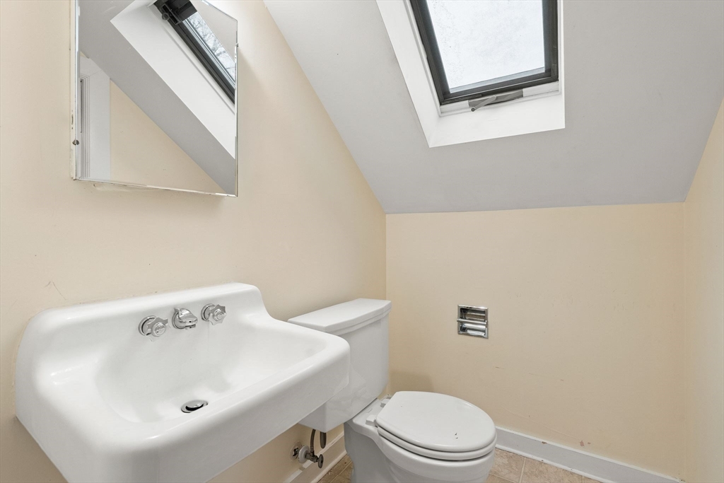 40-42 Upland Road Belmont, MA 02478 - Photo 29 of 35 a bathroom with a sink a mirror and a toilet