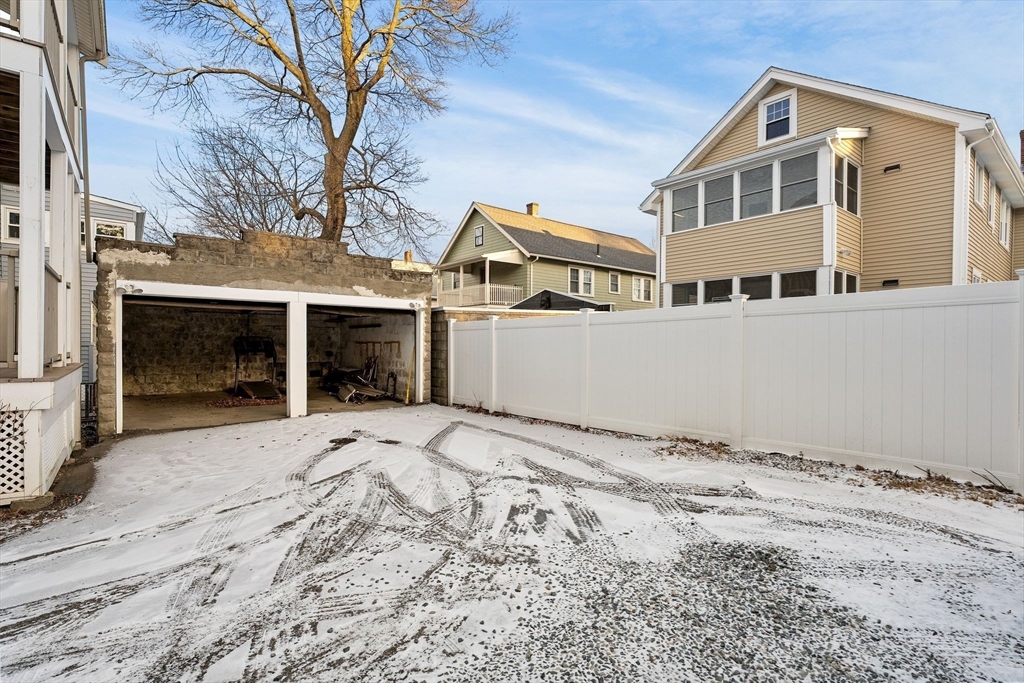 40-42 Upland Road Belmont, MA 02478 - Photo 32 of 35 a front view of a house with a yard and garage