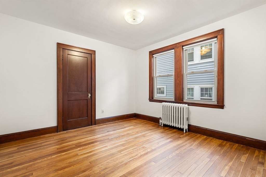 40-42 Upland Road Belmont, MA 02478 - Photo 10 of 35 a view of empty room with wooden floor and fan