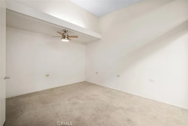 a spacious bathroom with a granite countertop sink mirror and toilet