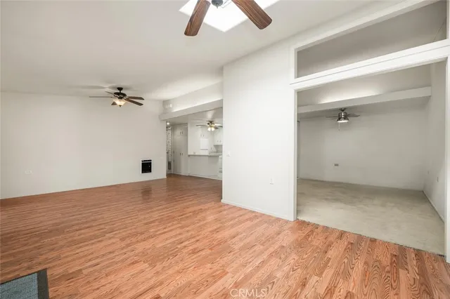 a view of empty room with ceiling fan