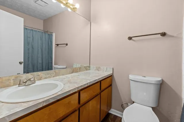 a view of a livingroom with a ceiling fan and window