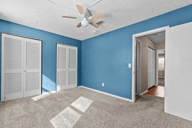 a bathroom with a sink a toilet and shower curtain
