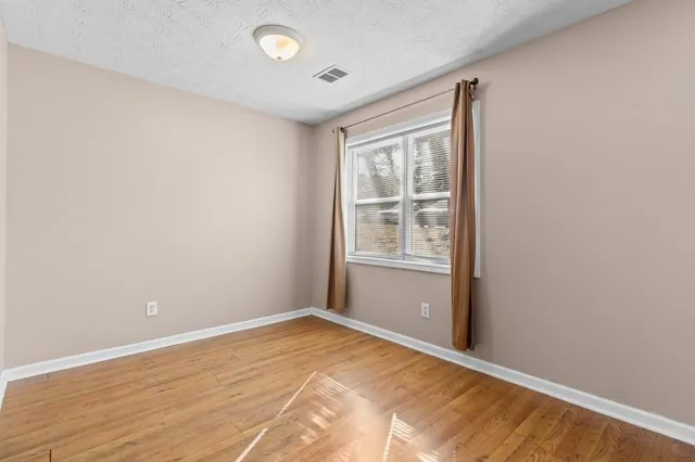 a kitchen with a stove a sink and a microwave