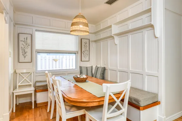 a dining room with furniture and window