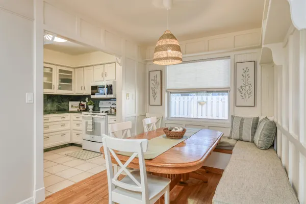 a kitchen with stainless steel appliances kitchen island granite countertop a refrigerator and microwave