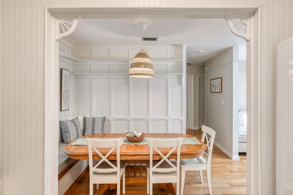 a dining room with furniture and window
